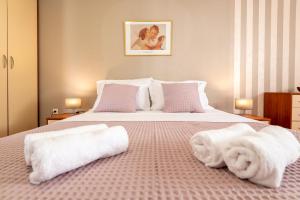 Posteľ alebo postele v izbe v ubytovaní Iva Apartment