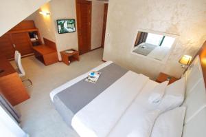 Postel nebo postele na pokoji v ubytování Hotel Porto In