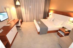 Postel nebo postele na pokoji v ubytování Hotel Porto In