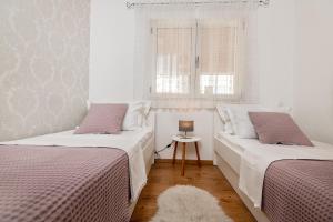 Posteľ alebo postele v izbe v ubytovaní Iva Apartment