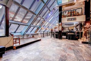 a large room with skylight ceilings and a bar at Mountain Green, Condos at Killington in Killington