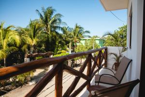 a patio area with a patio table and chairs at Villas Palmar Holbox in Holbox Island