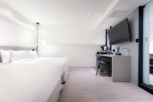 Voodi või voodid majutusasutuse KEEBE Hotel toas