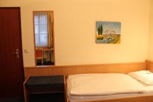 Postel nebo postele na pokoji v ubytování City Hotel Neuwied