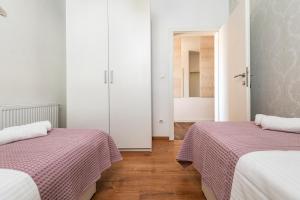 Posteľ alebo postele v izbe v ubytovaní Iva Apartment