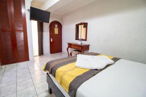 Postel nebo postele na pokoji v ubytování Hotel El Español Centro Historico