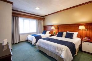 Postel nebo postele na pokoji v ubytování Hotel Florida