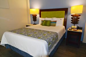 Postel nebo postele na pokoji v ubytování Hotel HBlue Centro