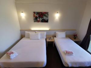 SERDANG LAKE VIEW RESORT客房内的一张或多张床位