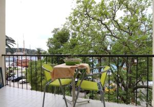 a table and chairs sitting on a balcony at Apartment JoviZ - 20m from the sea in Makarska