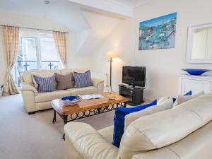 a living room with two couches and a coffee table at 19 Bolt Head in Salcombe