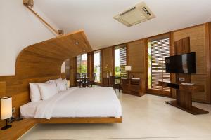 A bed or beds in a room at La Villa