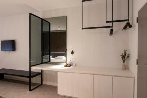 a bathroom with a mirror and a sink at Hotel Pax in Diksmuide +32 photos