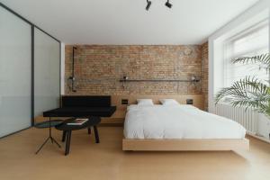 Posteľ alebo postele v izbe v ubytovaní Owntown Apart Hotel