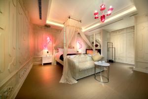 Postel nebo postele na pokoji v ubytování Yen Jim Boutique Motel
