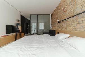 Posteľ alebo postele v izbe v ubytovaní Owntown Apart Hotel