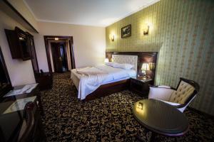 Postel nebo postele na pokoji v ubytování Grand Hotel Orient Braila