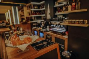 a counter with a plate of croissants on a table at PENSIUNE RESTAURANT CAPRA NEAGRA in Moisei