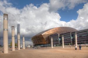 a large building with columns in front of it at City Retreat, 2 Bed House with Cloudstream Hot Tub in Cardiff
