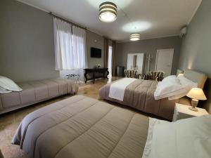 Postel nebo postele na pokoji v ubytování BB SUITE Siracusa