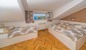 Posteľ alebo postele v izbe v ubytovaní Apartment Residence Narona