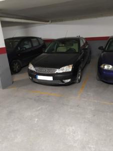 a group of cars parked in a parking garage at Casa Rural Azahar in Priego de Córdoba