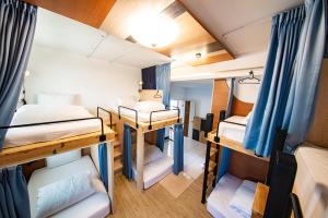 Postel nebo postele na pokoji v ubytování D.C. Inn