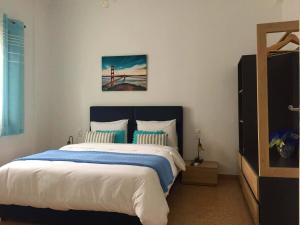 A bed or beds in a room at D&E Technopolis Apartments