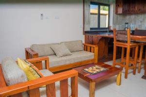 a living room with a couch and a table at Upland Estates Serviced Apartments in Lusaka