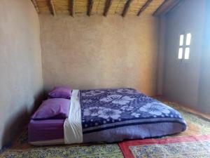 Giường trong phòng chung tại Sahara Peace