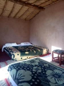 Łóżko lub łóżka w pokoju w obiekcie Sahara Peace