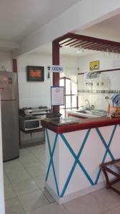 Η κουζίνα ή μικρή κουζίνα στο Blue Ocean Village