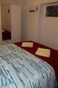 Posteľ alebo postele v izbe v ubytovaní Apartment MIS Floura