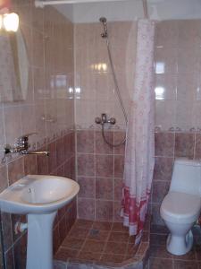 a bathroom with a sink and a toilet and a shower at Villa Prolet in General-Kantardzhievo +22 photos