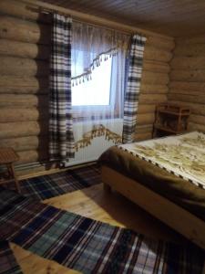 Postel nebo postele na pokoji v ubytování Cottage Лісовий
