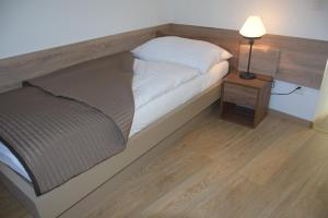 Ein Bett oder Betten in einem Zimmer der Unterkunft Hotel Sonne