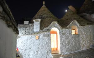 an outside view of a building at night at Trulli e Puglia Luxury Suite in Alberobello
