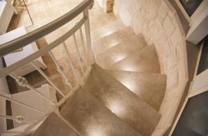 an overhead view of a metal staircase in a building at Trulli e Puglia Luxury Suite in Alberobello