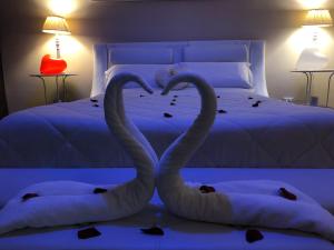 Cama ou camas em um quarto em B&B Baciami Ancora