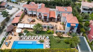 an aerial view of a house with a swimming pool at Alacati Kapari Hotel - Special Category in Alaçatı