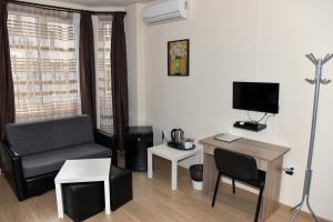 Μια τηλεόραση ή/και κέντρο ψυχαγωγίας στο Twain Apart&Rooms