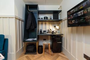 a small room with a table and a shelf at The Clarence in Dublin