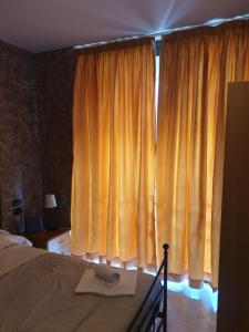 Postel nebo postele na pokoji v ubytování Caravaggio Apartments