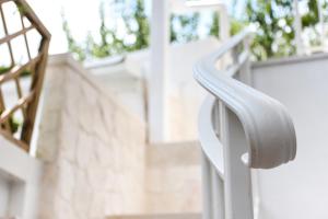 a close up of a white handle on a door at Trulli e Puglia Luxury Suite in Alberobello