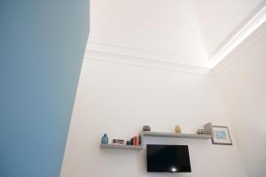 TV a/nebo společenská místnost v ubytování Teatro Suites Rooms + 33 fotografií