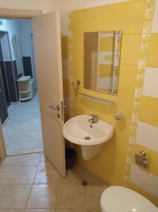 a bathroom with a sink and a toilet at RUBIN-2 in Pomorie +21 photos