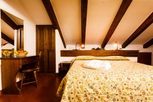 Postel nebo postele na pokoji v ubytování Hotel Biancaneve