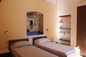 Postel nebo postele na pokoji v ubytování Room and Breakfast I Gemelli
