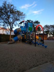 a playground with a slide in a park at Luz y Mar in Aljaraque