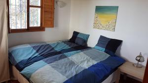 Posteľ alebo postele v izbe v ubytovaní Casa Feliz